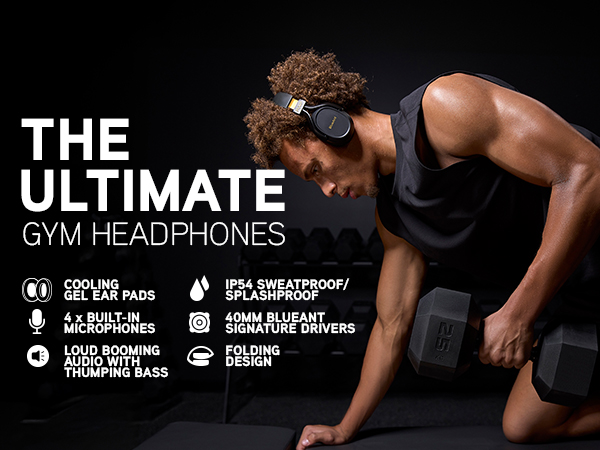 Dyson trains in the gym wearing Pump X headphones, lifting dumbbells with focus and determination.