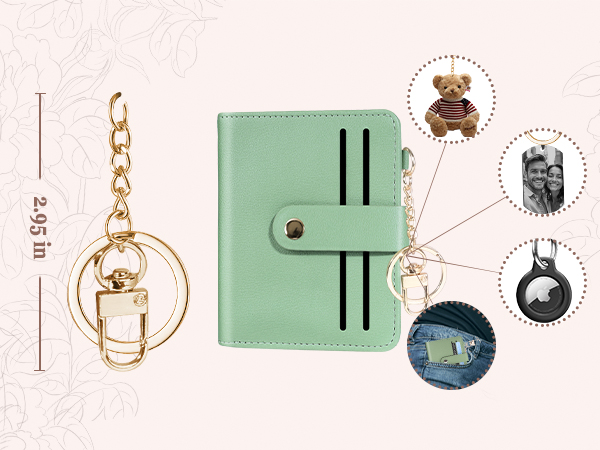 Women's wallet with gold keyring, shown with dollar, photo, AirTag attachments.