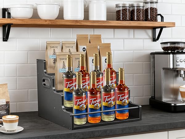 Coffee syrup bottle organizer for home cafe, tiered stand for Torani syrups and accessories.