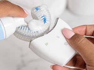 Toothpaste being applied to a white Autobrush