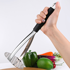 a hand hold a potato masher