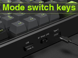 a keyboard with a black keyboard and a green light on it.