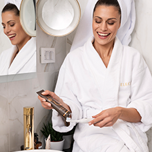 Woman brushing her teeth with Theodent