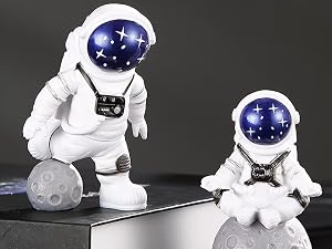small blue astronaut statues