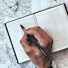 Photo shows person writing in a planner with the G2 Edge pen