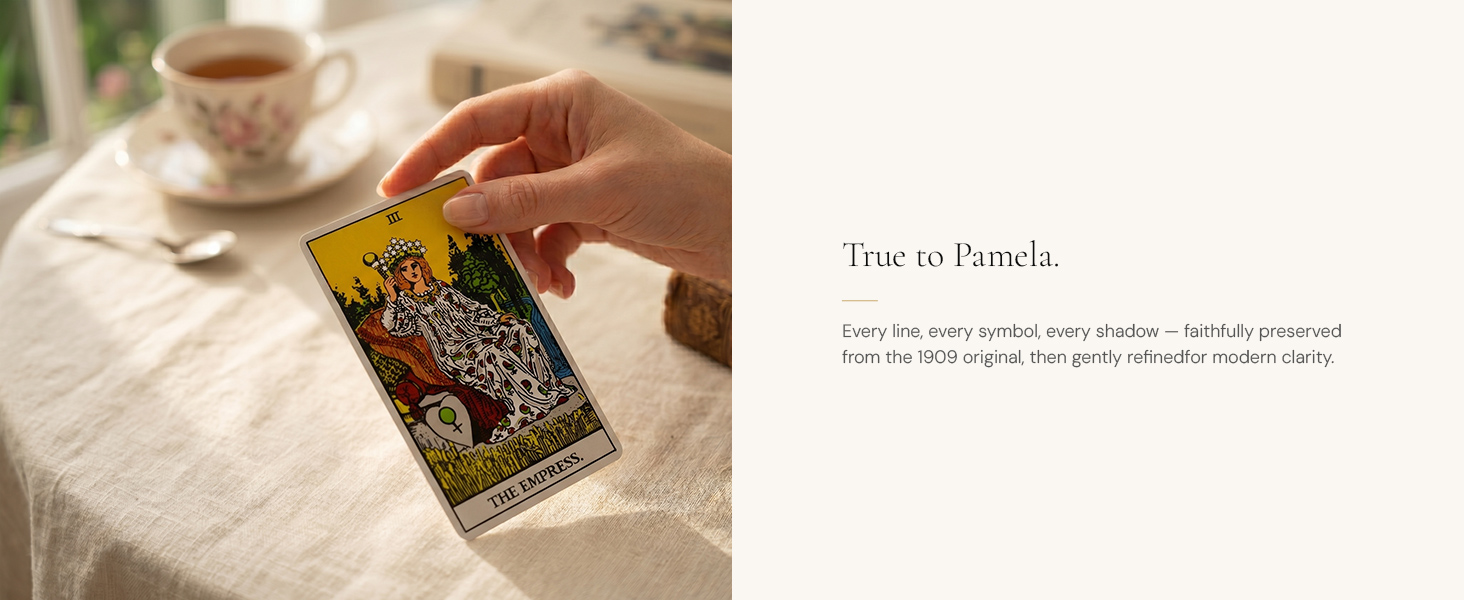 Hand holding The Empress card from the Dionysus Classic Tarot Deck beside a teacup.