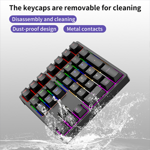 Text reads 'The keycaps are removable for cleaning'. Multiple images showing mechanical keyboard keycaps with RGB lighting in purple and blue colors against water splash effects.