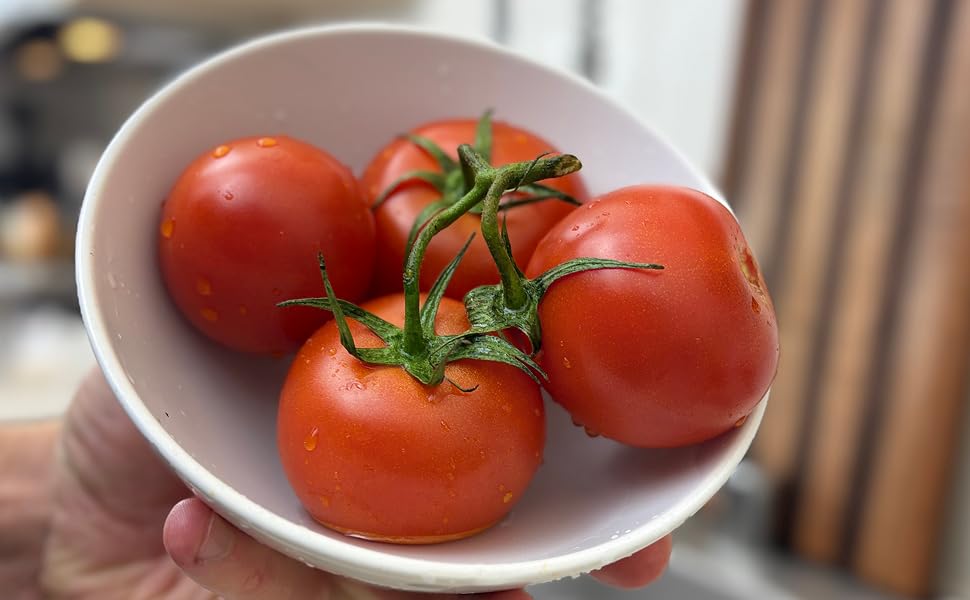 Clean bowl of washed tomatoes