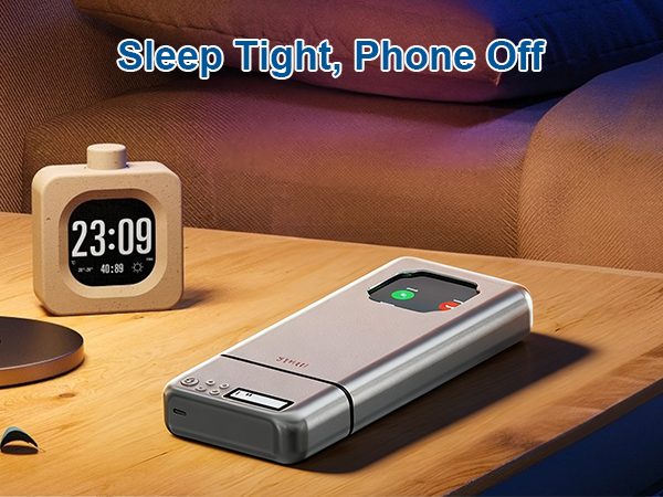 Text reads 'Sleep Tight, Phone Off' and '23:00'. Digital alarm clock on bedside table next to a flip phone in darkened bedroom setting.