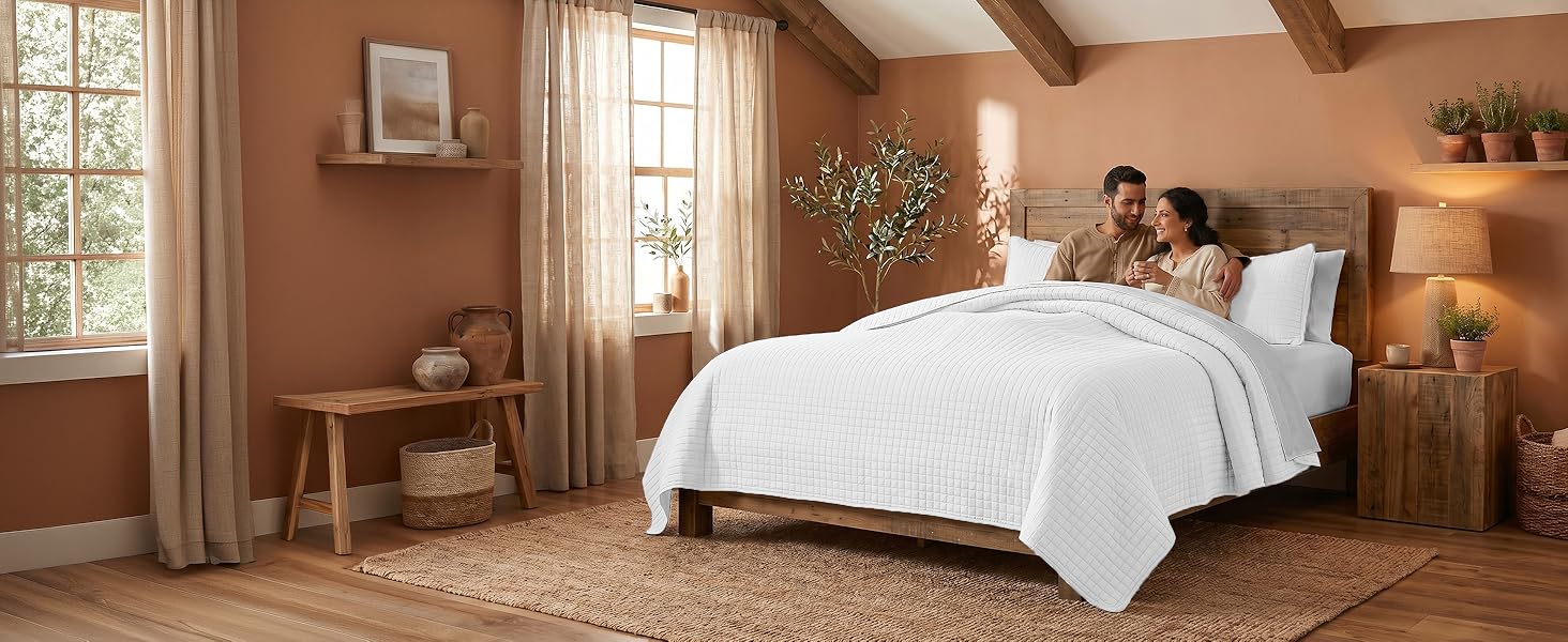 Full queen quilt set in dark taupe with oversized dimensions and layered bedroom styling