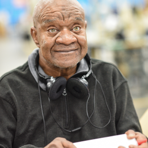 Photo of an employee who is blind that work is the Pinnacle Mercantile Department.