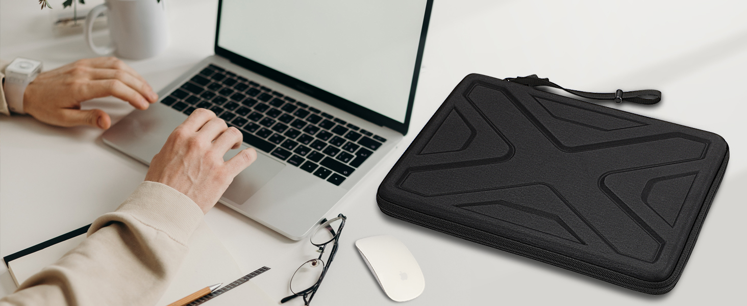a laptop and mouse on a desk