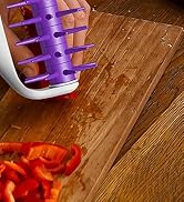 pizza dough docker roller piercing pizza base to help crust bake evenly