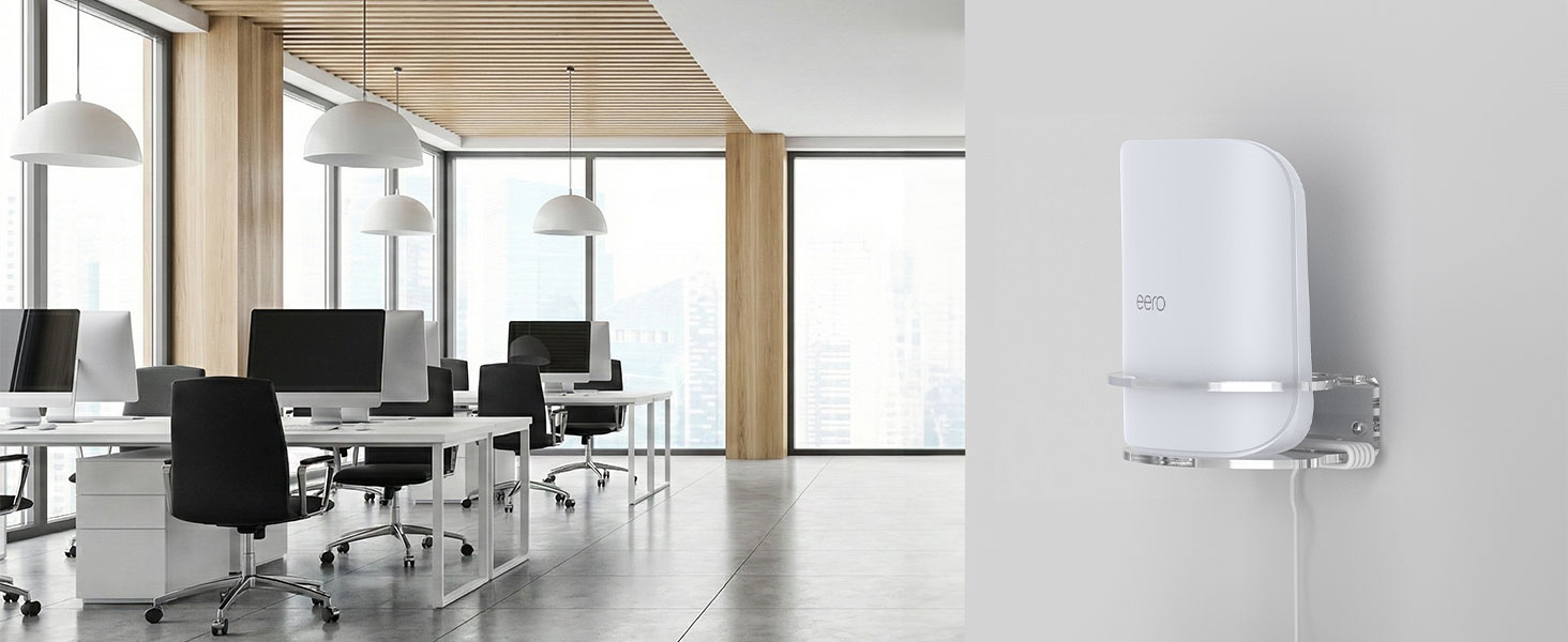 Modern office space with white walls and multiple black office chairs. Wall-mounted white device visible on right side of frame.