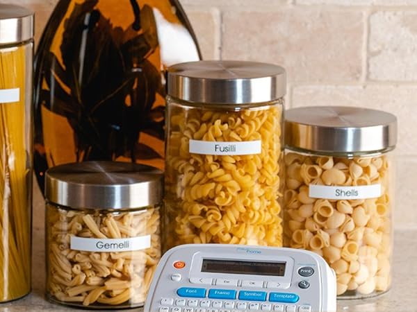 Kitchen scene with Ptouch Home label maker and labeled pasta canisters