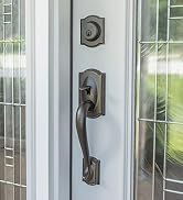 Schlage Camelot Front Entry Handleset with Deadbolt in Aged Bronze Finish on front door