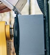 Camper hooking up their Camco RV power cord to the campground power pedestal