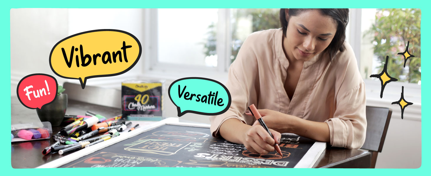 Woman using vibrant, versatile, and fun Chalkola chalk markers on a chalkboard