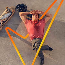 Man resting after skateboarding + tick symbol around him