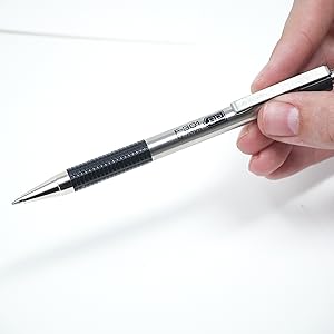 zebra pen f-301 retractable ballpoint pen closeup, desk background