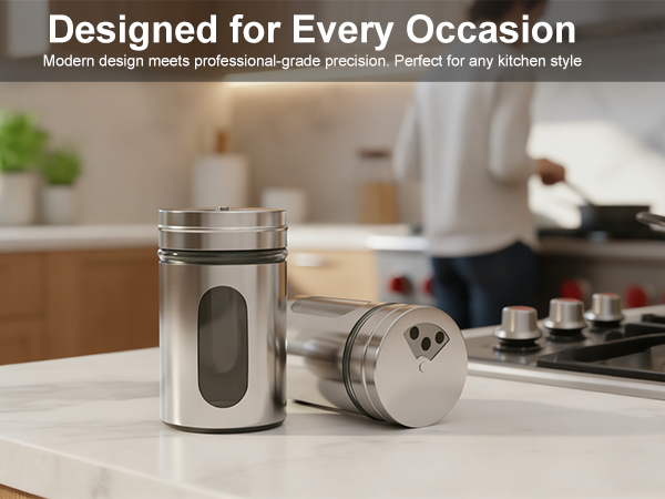 Modern stainless steel salt and pepper shakers for kitchen counter decor and professional cooking.