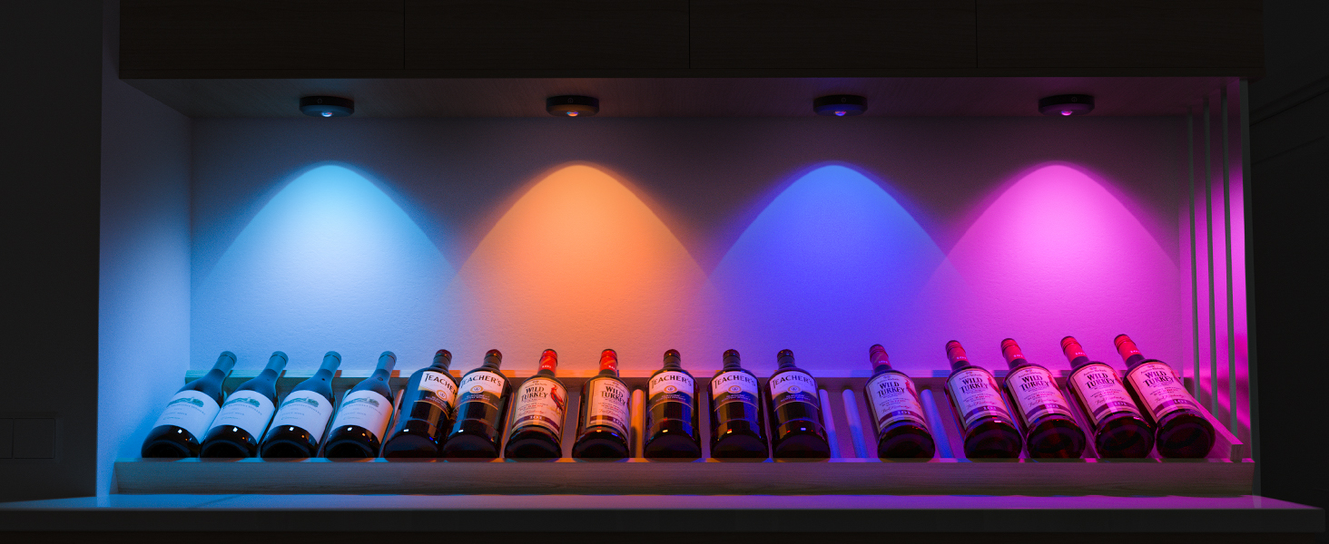 Wine rack displaying multiple bottles under colored LED lighting. Blue, orange, purple, and pink lights illuminate different sections of the rack.