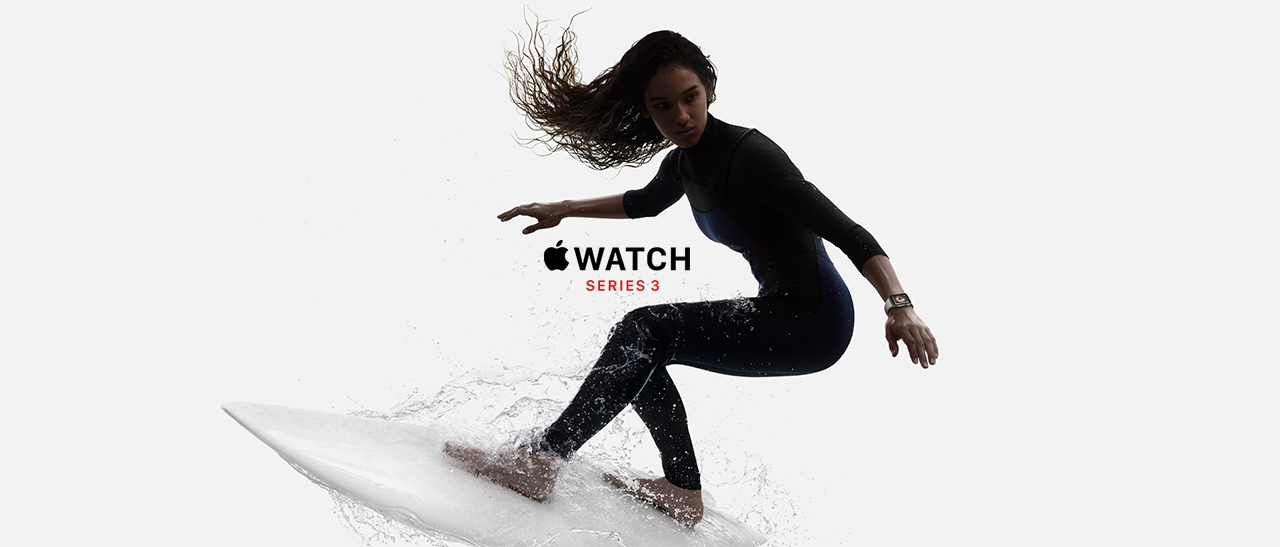 A woman surfing while wearing the Apple Watch Series 3