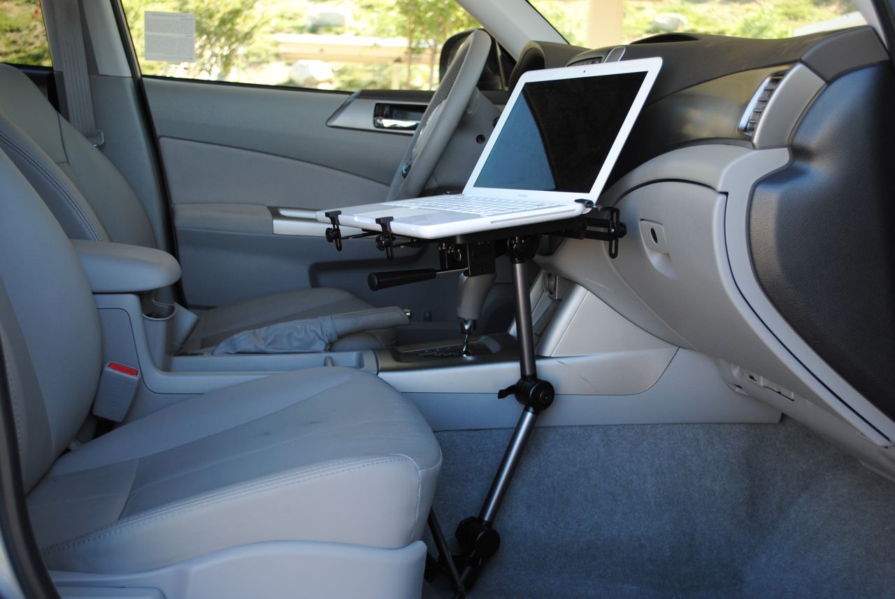  The Mobotron MS-426 on display installed in a vehicle, holding a laptop on the tray  