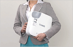 A Female Office Worker Carrying the Casio XJ-V2 Projector by Their Side