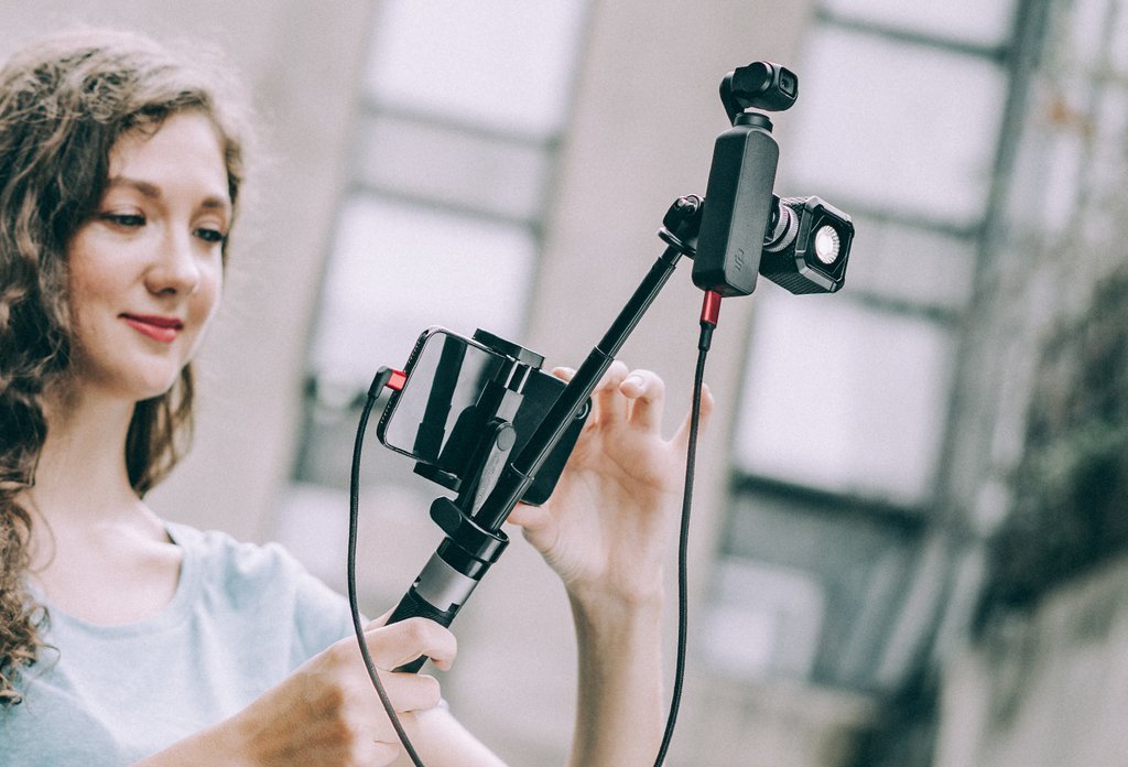 PGYTECH Protective Case beside the compatible action cameras