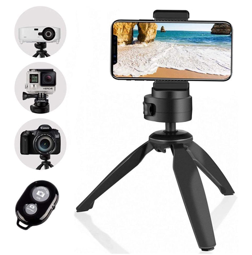 A smart phone is installed on a tripod next to projector on a tripod, a white camrea on a tripod, a DSLR on a tripod, and a bluetooth controller.