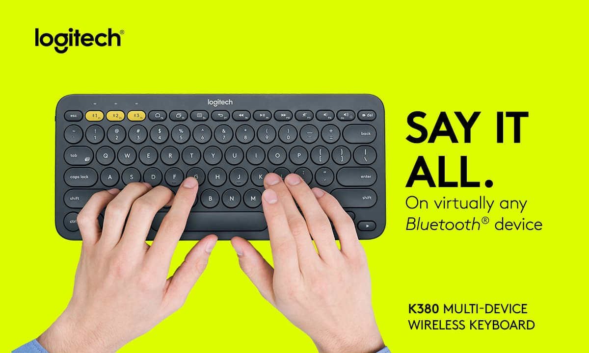 a pair of hands typing on Logitech K380 keyboard