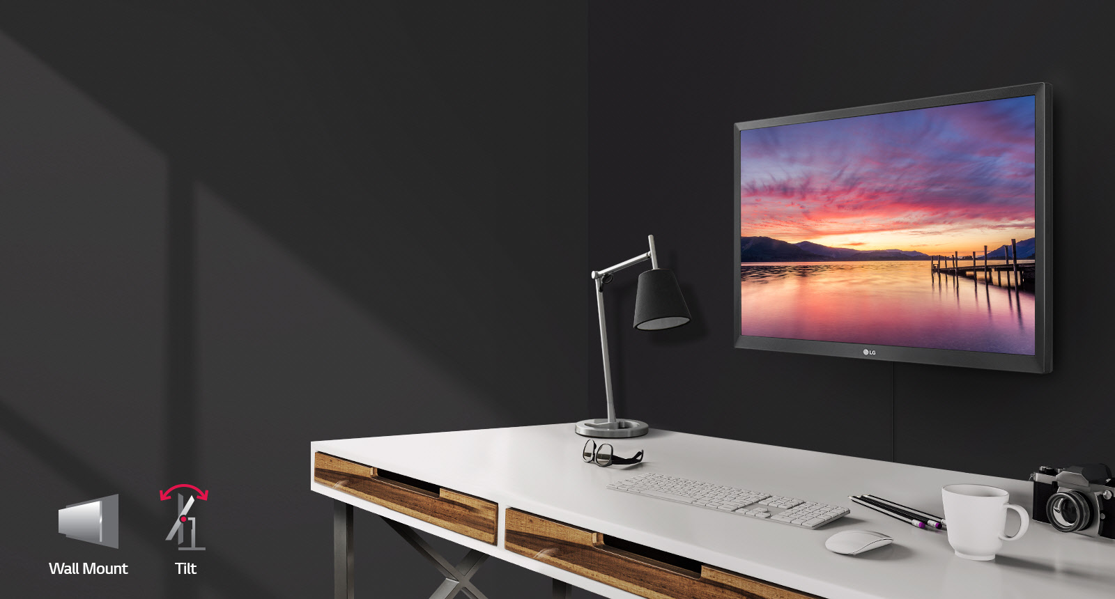 wall-mounted monitor above a desk workspace