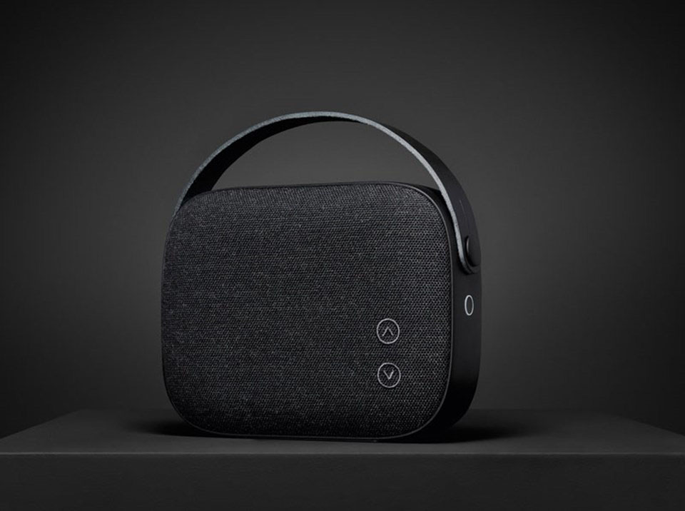 Black HELSINKI Speaker on a Black Desk