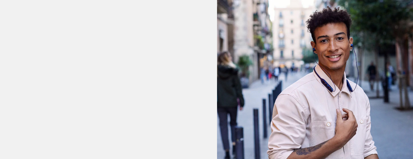 A boy wears JBL Live 220 Bluetooth In-Ear Neckband Wireless Headphone