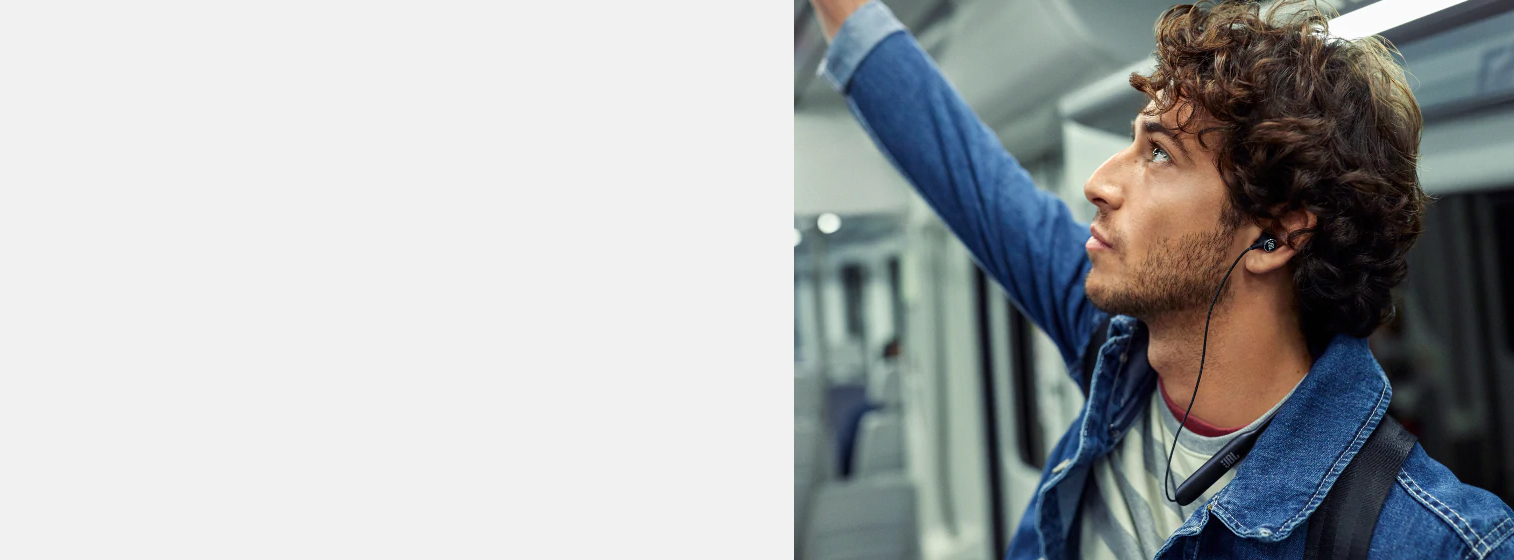 A boy wears JBL Live 220 Bluetooth In-Ear Neckband Wireless Headphone
