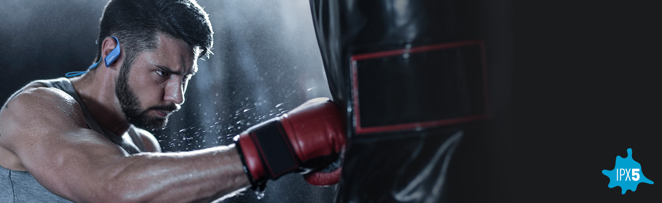 A boy wearing WINGS Ultra-Light Wireless Bluetooth Sport Earphones