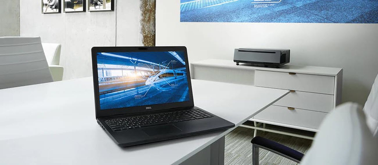 Open Laptop on a Meeting-Room Table, Next to the Dell Projector that's on a Cabinet