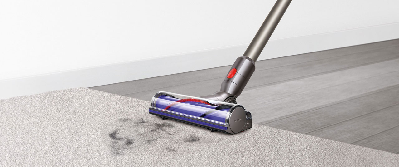 Closeup of the Dyson V8 cleaning on a carpet   