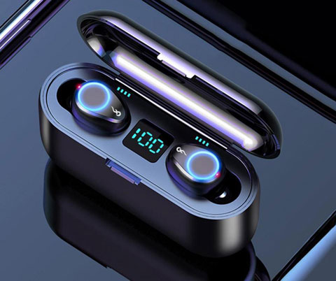  The Bluetooth earphones on display in the charging case, angled slightly to the left, on a shiny surface  