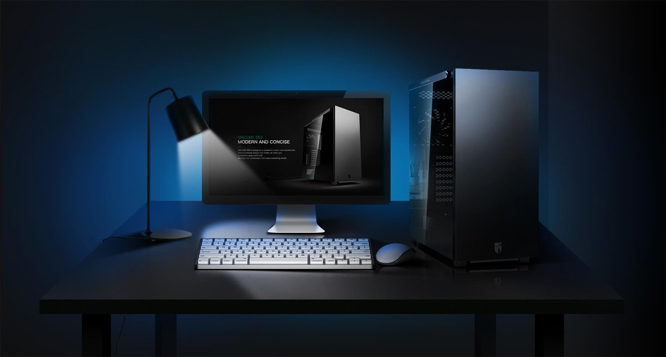 MACUBE 550 at a desk with monitor, lamp, keyboard and mouse