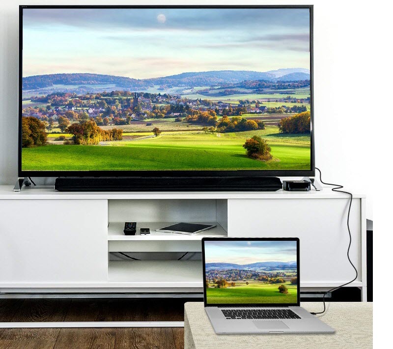 a TV connected to a laptop in mirror mode showing a beautiful scenery