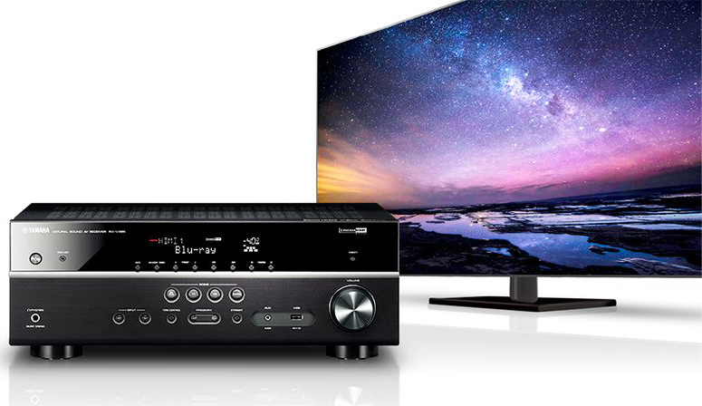 Yamaha RX-S602 Slimline 5.1-Channel AV Receiver with MusicCast facing forward and TV