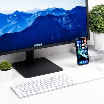 Computer, phone and keyboard on the table