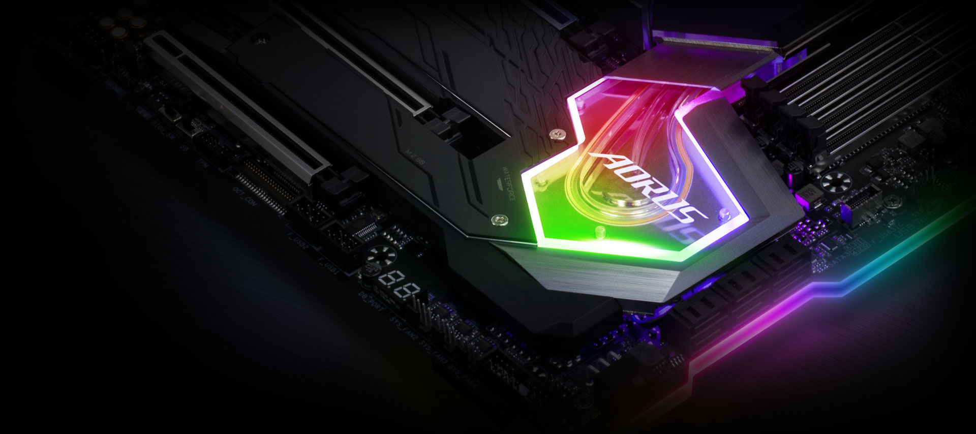 Closeup of the RGB-lit AORUS logo on the motherboard