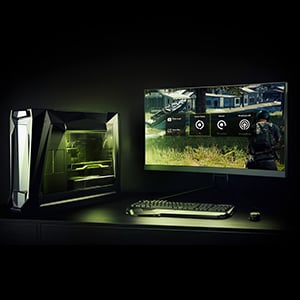A PC gaming setup in dark lighting with lights coming from the keyboard and the inside of the PC case