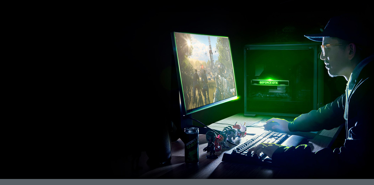 A boy is playing games in front of the computer