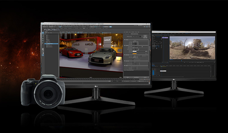 A DSLR camera next to two monitors that show photo and video editing software