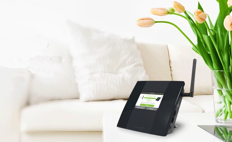 TAPEX range extender on a table next to a white couch