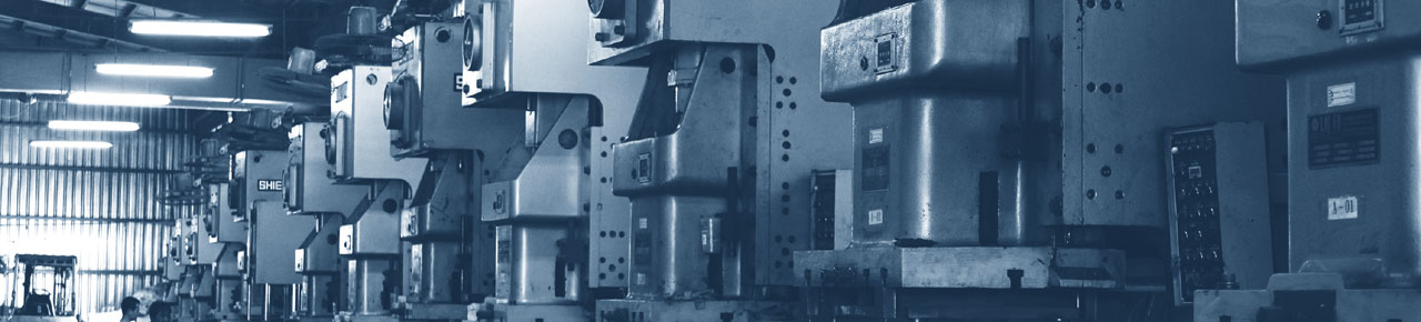 A warehouse with various manufacturing machines lined up